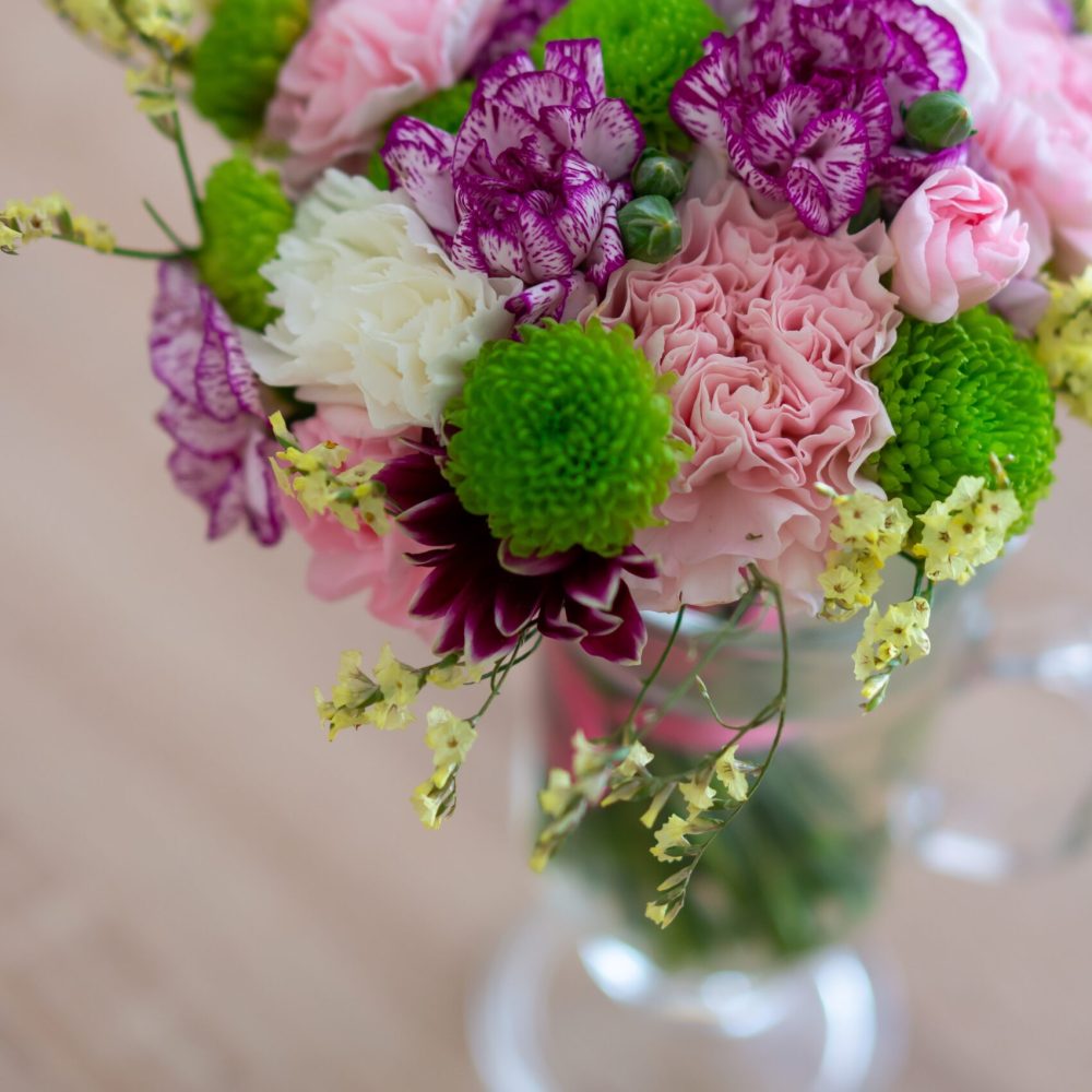 A high angle shot of a beautiful bouquet of flowers in a glass